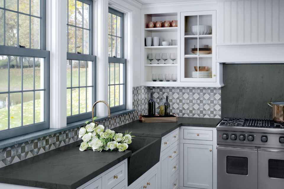 blue and gray geometric tile backsplash in kitchen